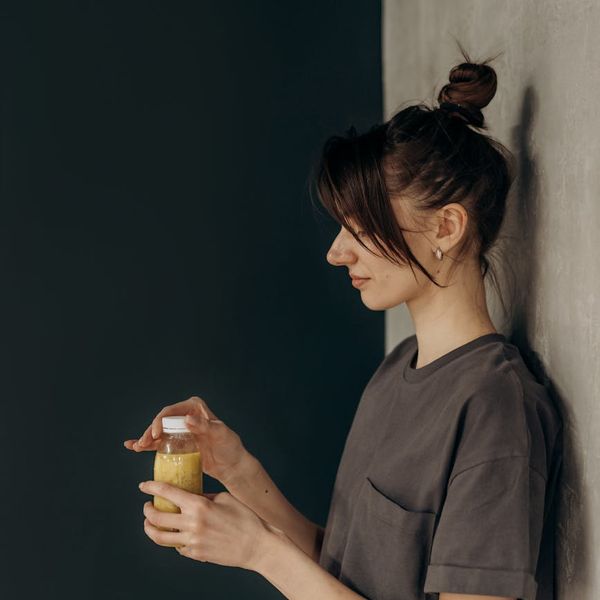 Person enjoying a moment of calm after a workout, looking energetic.